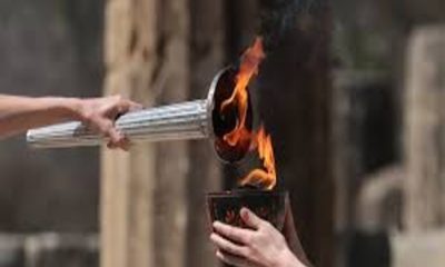 Fiamma Olimpica, Torcia, Tedofori